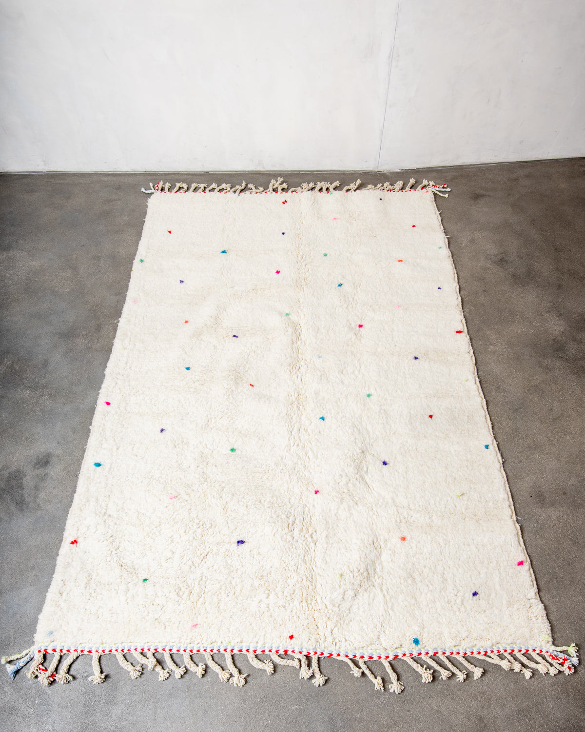 Modern, designer, handcrafted Berber rug from Morocco. Beniourain carpet with beautiful colours and patterns and fluffy wool texture.